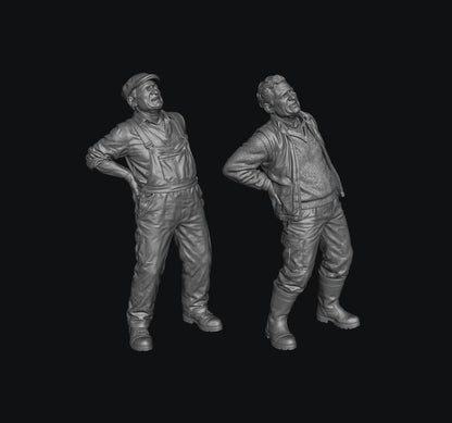 Two unpainted grey resin 3D printed miniature figures of male farmers holding their backs in pain.