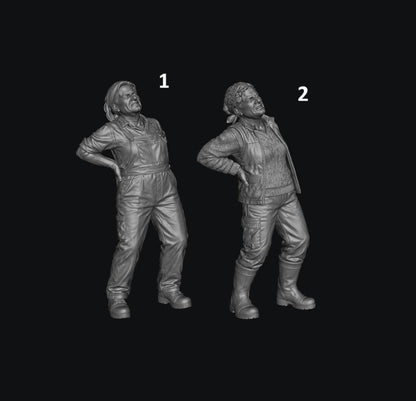 Two unpainted grey 3D resin model figures of a female farmer holding her back in pain, wearing overalls or vest.