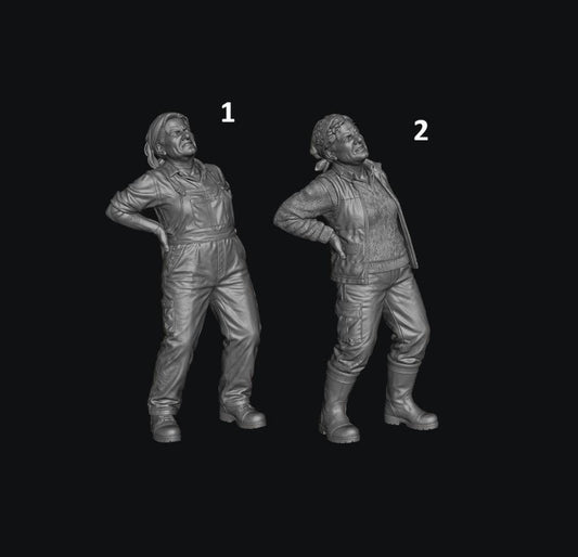 Two unpainted grey 3D resin model figures of a female farmer holding her back in pain, wearing overalls or vest.
